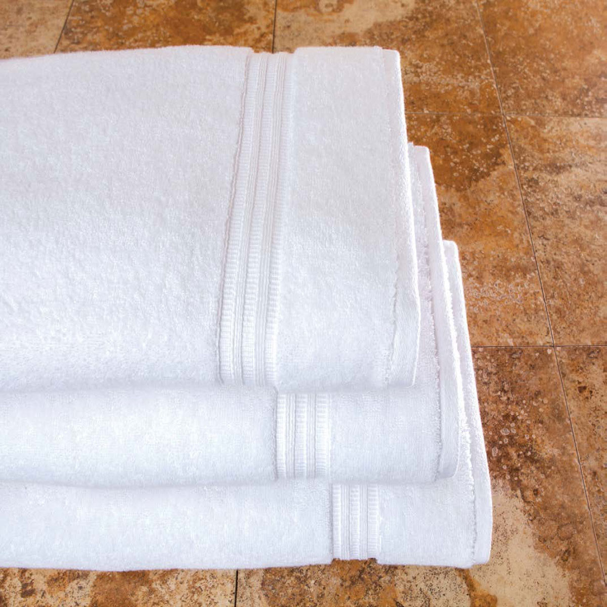 Before buying, how can I feel the softness and texture of the Villa de Lucca towels?