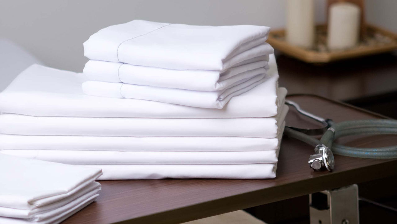 Can you specify the materials used in the T-180 Percale White Hospital sheets?