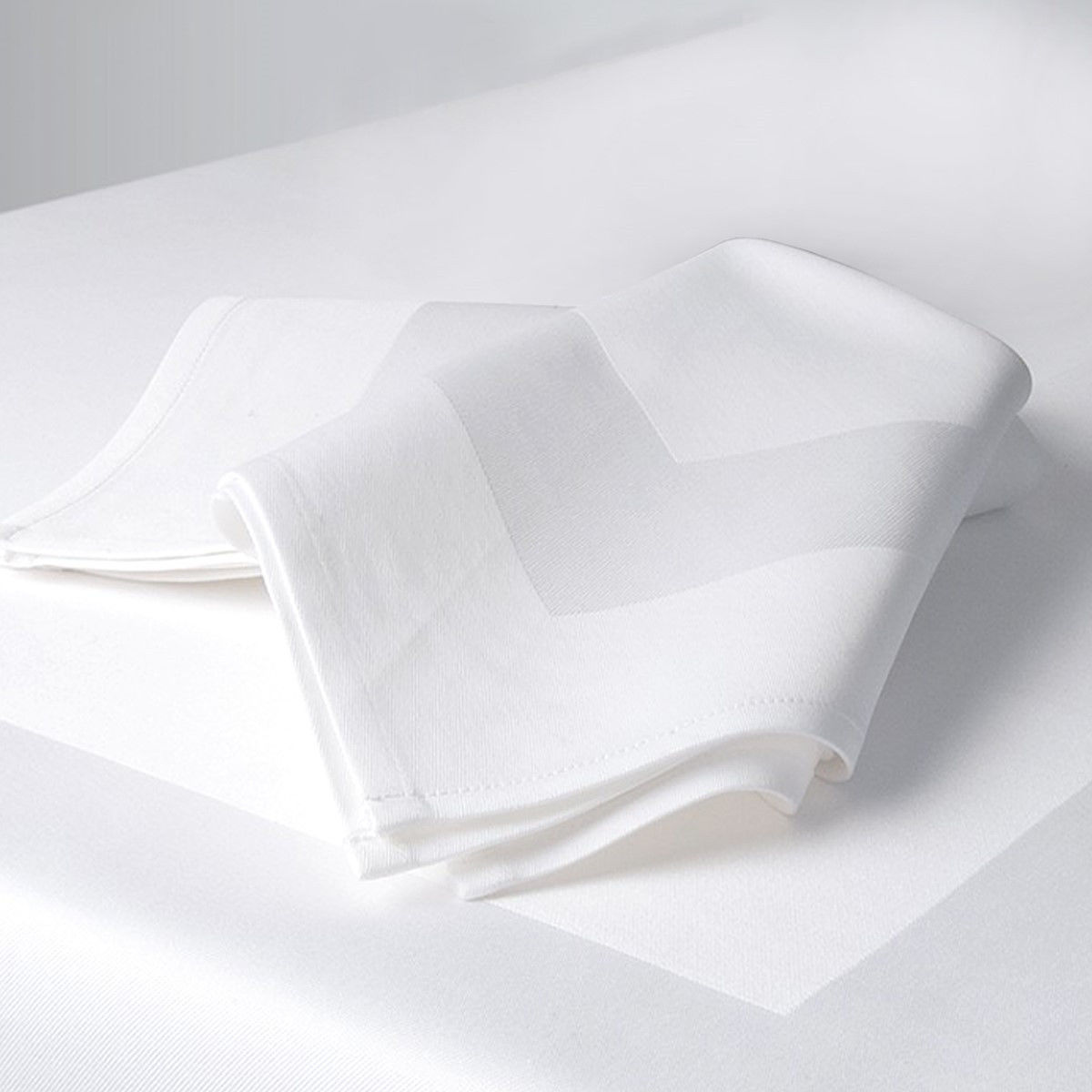 How do you fold satin napkins for a wedding?