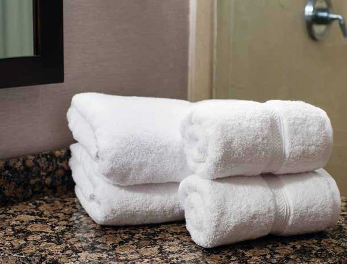 What are the materials used to make the plush towels from Thomaston Mills?