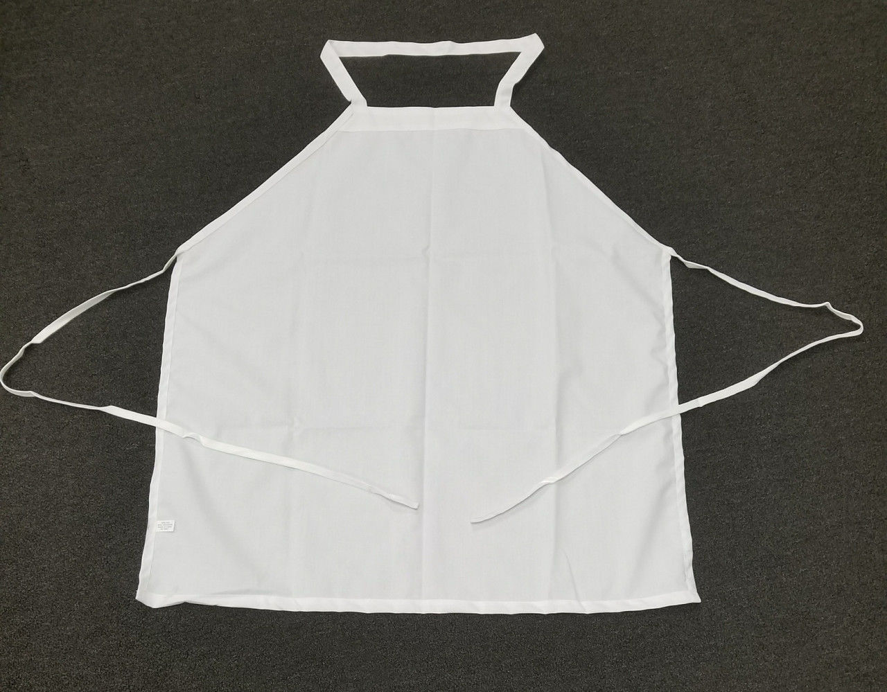 Are the white bib aprons made from polyester?