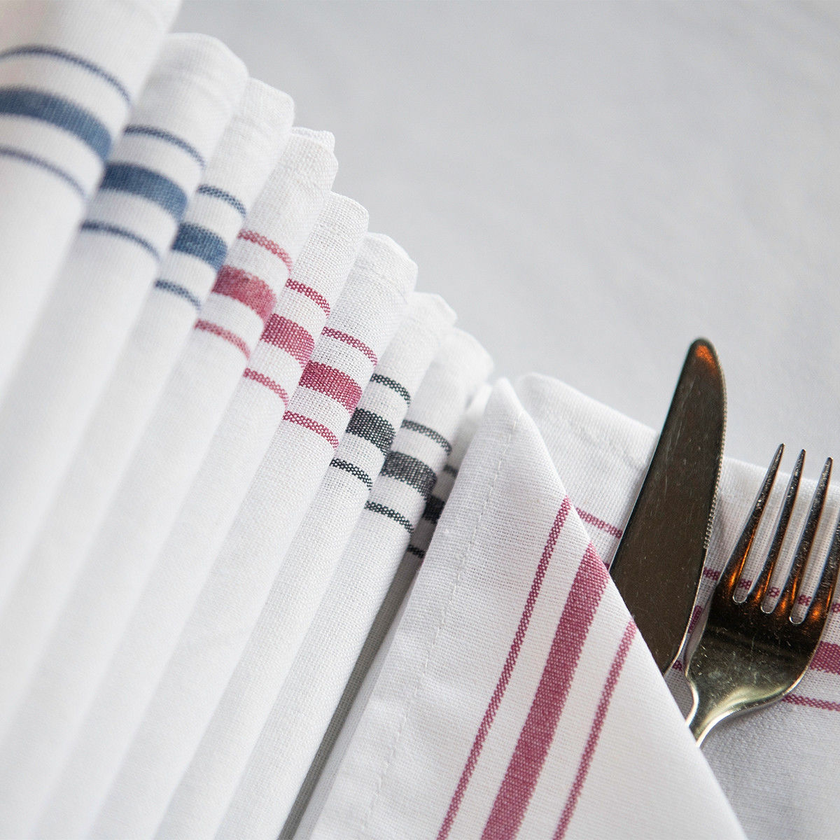 What material are these Cotton Bistro Striped Napkins made of, and what are their notable qualities?