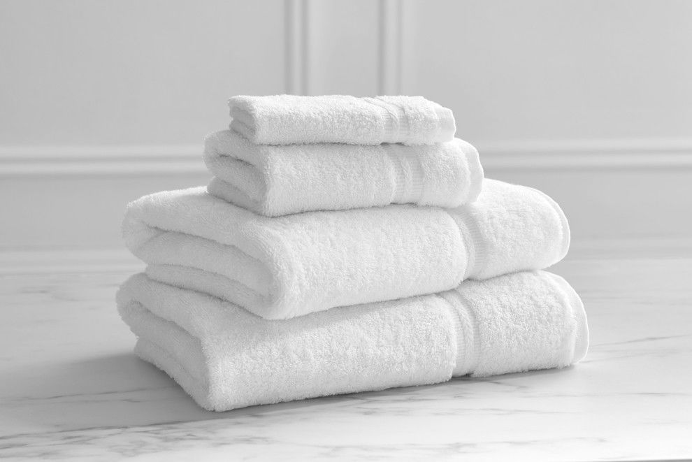 What materials are the Wellington by Welspun towels with a Dobby border made from?