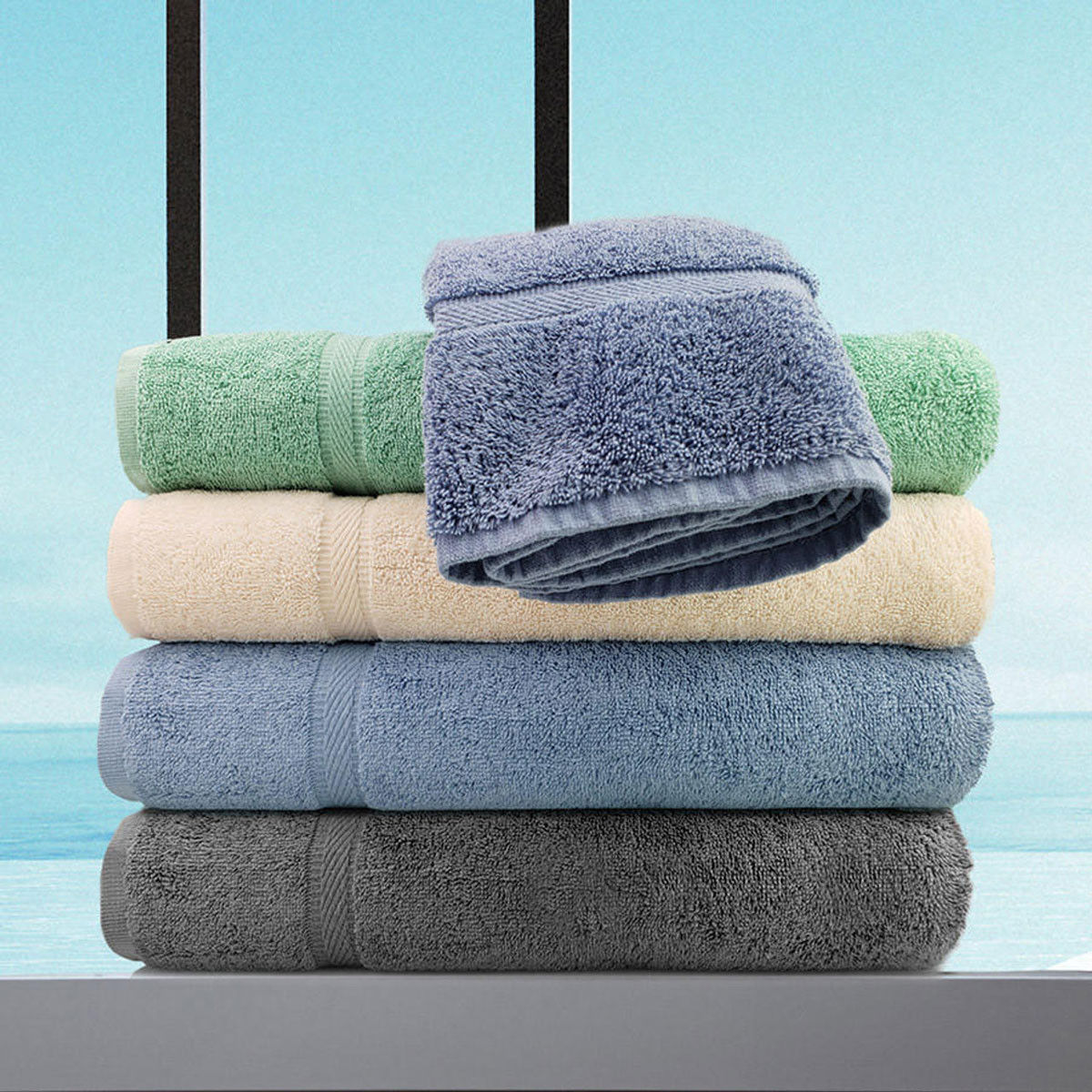 Can you tell me what material the Charcoal Grey Oxford Imperiale Towels are made of?