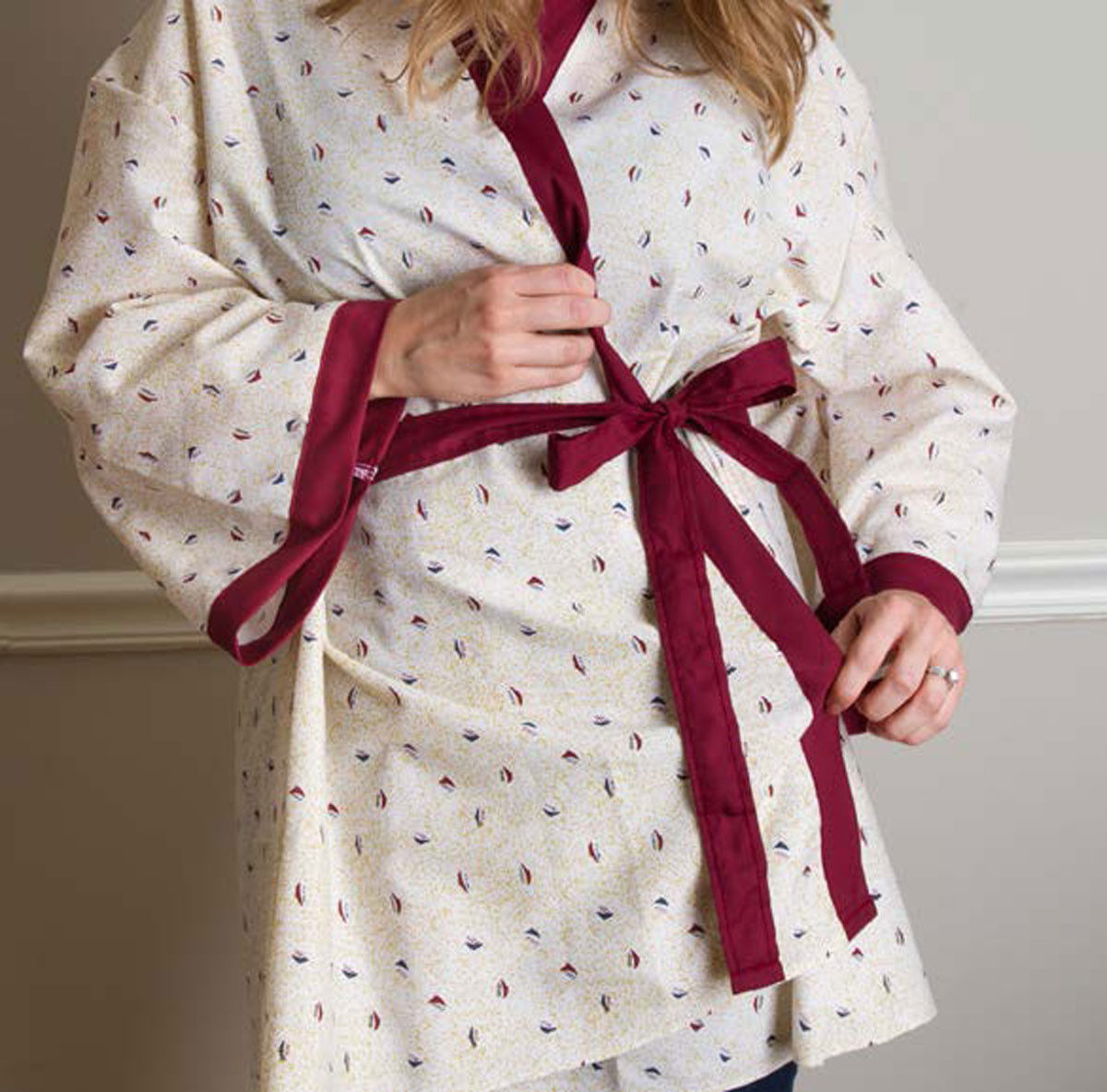What advantages do these mammography gowns provide in the form of capes and robes?