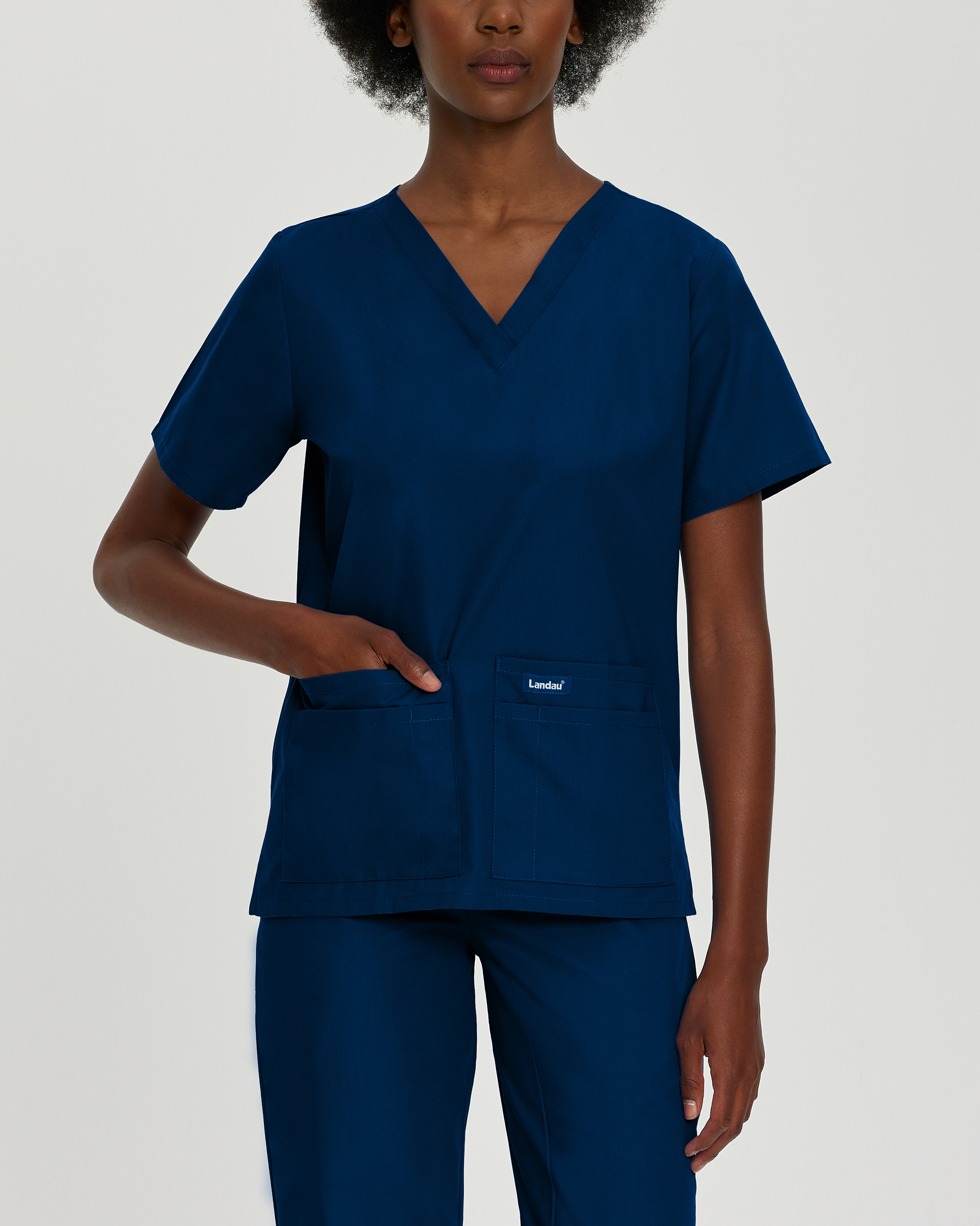 Do Landau scrub tops come in different colors and sizes?