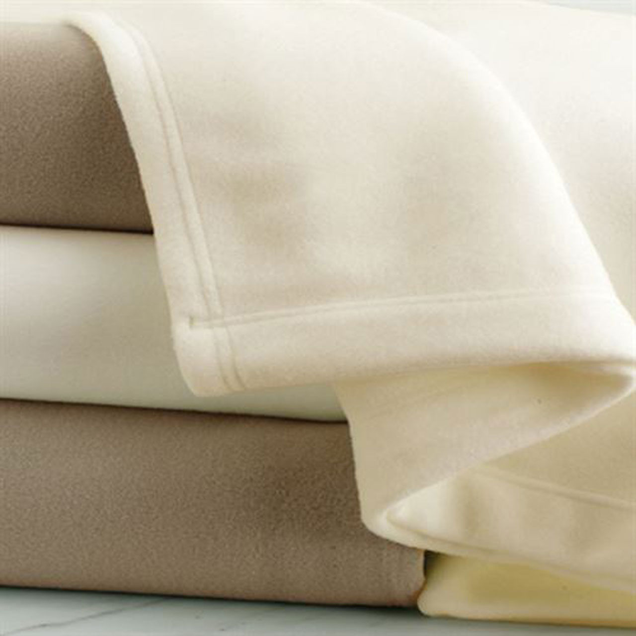 How do you wash a 100% polyester throw blanket?