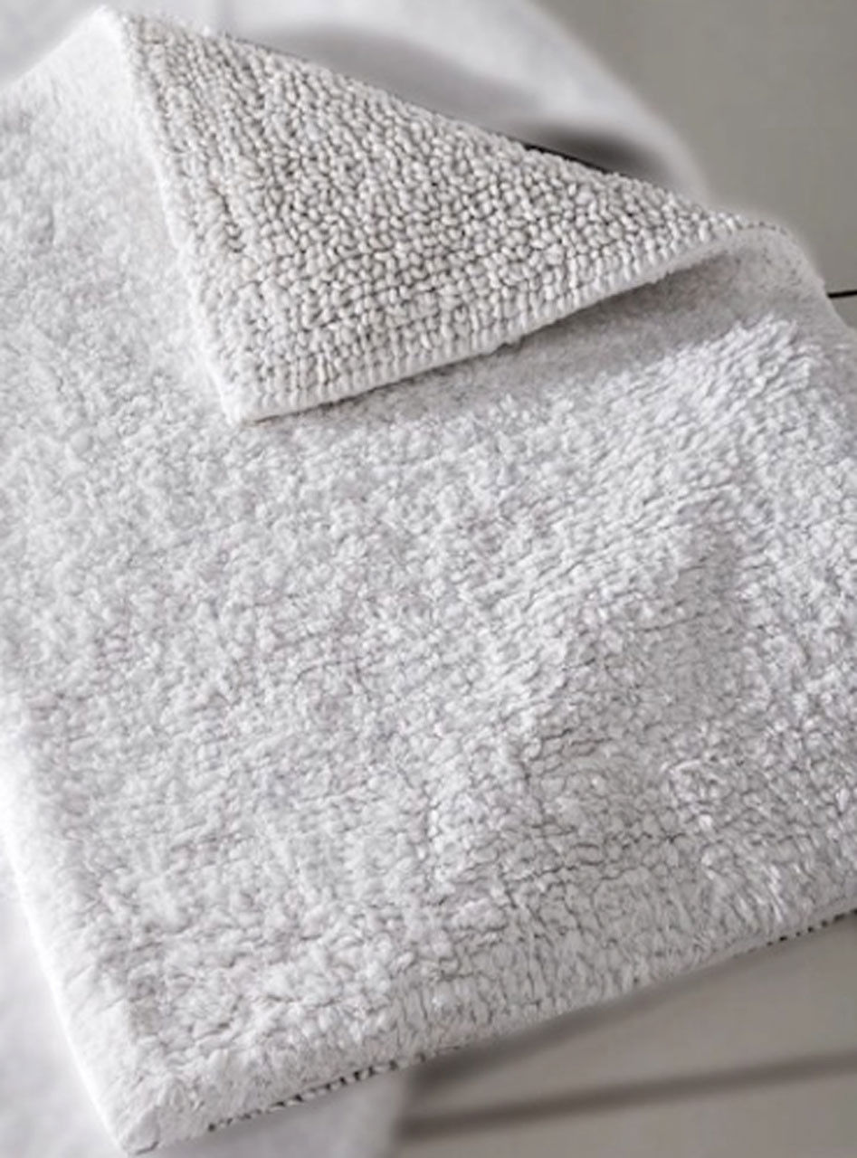 How do you clean a cotton bath mat?